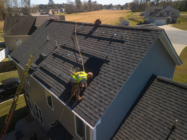 istock Solar Panel Installer - Safety Harness - Private Home - Sustainable Energy - Mounting Rails - Drone POV 2159417137