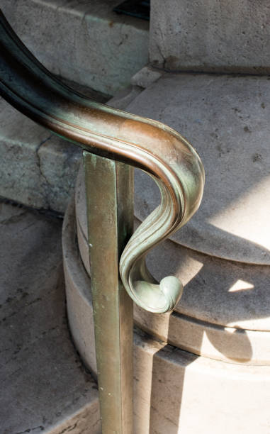 istock Old worn handrail on steps outside historic building 2159417315