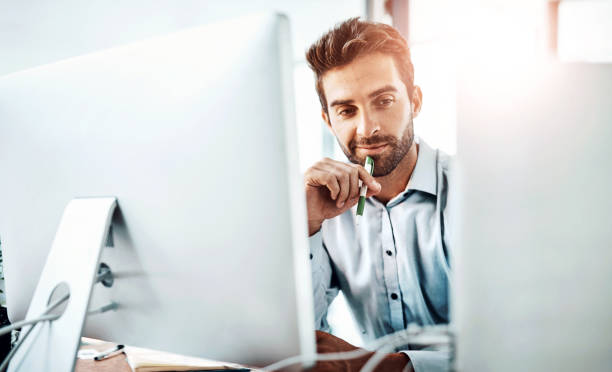 istock Thinking, businessman and computer in office for planning, brainstorming and report at desk. Male professional, technology or idea in company for business growth, development and decision or choice 2159420619