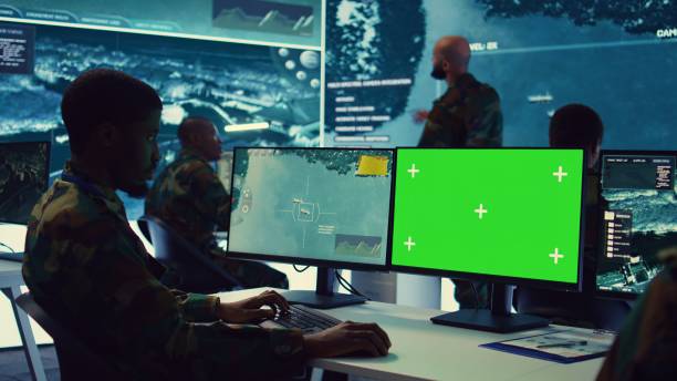 istock Intelligence analyst reviews ships activity next to an isolated mockup screen 2159421409