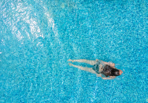 Free Stock Photo of Young Woman relaxing in Swimming Pool | Download ...