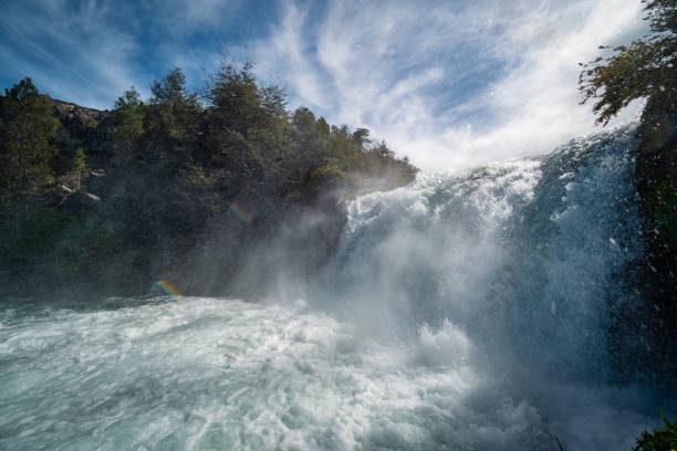 Algae tints rock pool turquoise  as water gushes in after opening Aratiatia dam gates at Taupo on Waikato River.