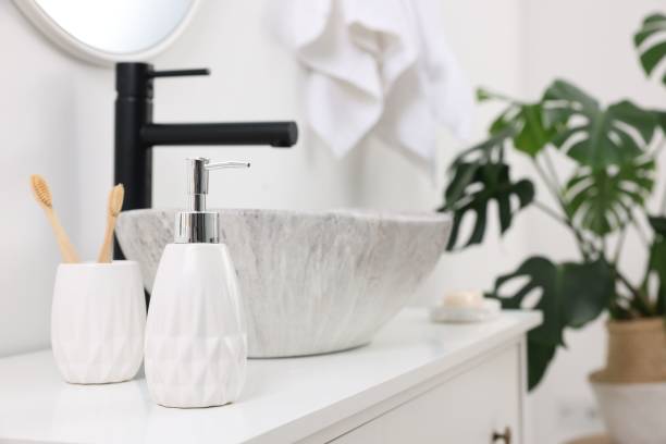 istock Different bath accessories and personal care products on bathroom vanity indoors, space for text 2159425604