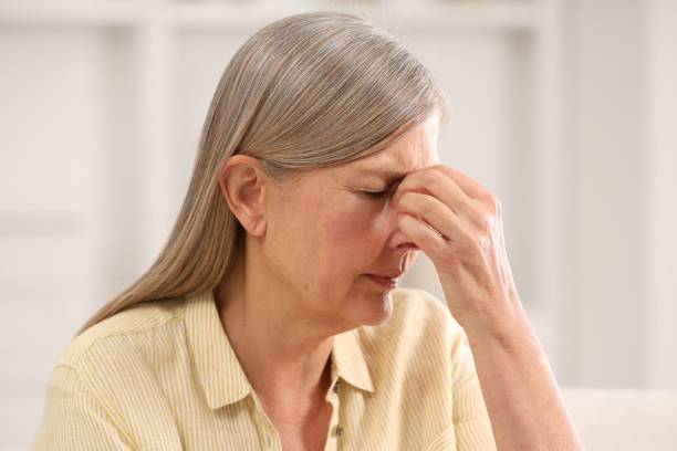 istock Menopause. Woman suffering from headache at home 2159426686