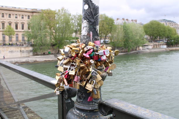 istock Love locks on a lamp post in  Pont des arts bridge in Paris. 2159429206