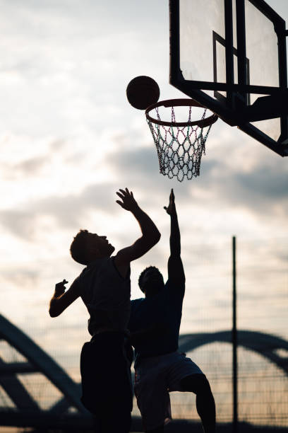 istock Silhouette action of a basketball game 2159431386