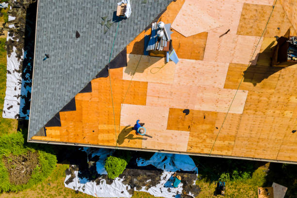 istock Roof repair by replacing old asphalt bitumen a shingles 2159437598