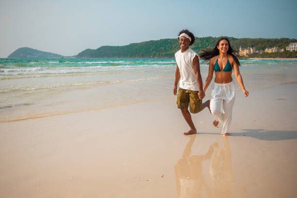 istock Joyful Beach Escape with Young Couple in Tropical Paradise 2159438100