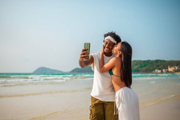 istock Joyful Couple Taking Selfie on Beach Vacation 2159438121