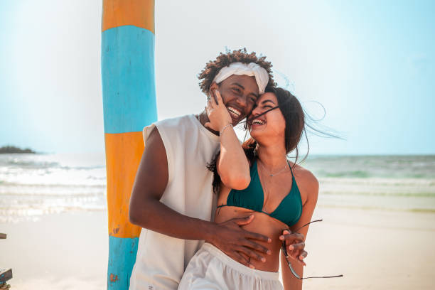 istock Affectionate Couple Embracing on Beach Vacation 2159438162
