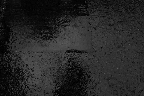 Abstract Backgrounds : Wet bitumen on a street  (with monochrom sensor)