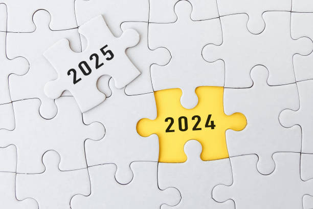 Pieces of jigsaw puzzle with word 2025 and 2024
