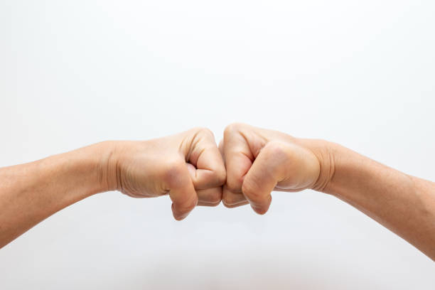 fists of both hands pressed together