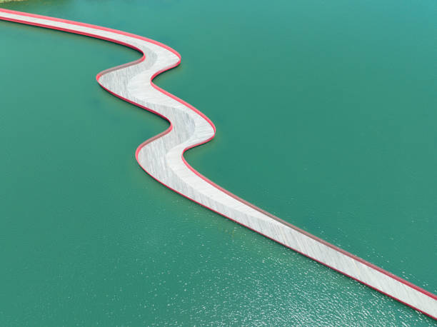 istock Pedestrian bridge over the lake 2159449225