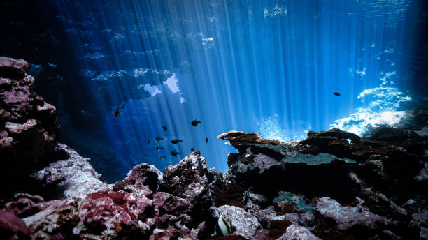 istock Rays of light inside a cave in the deep blue ocean 2159450148