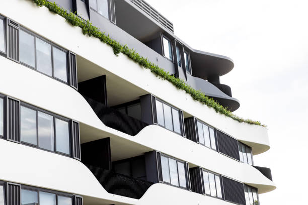 istock Closeup top part of new, modern apartment building, background with copy space 2159455607