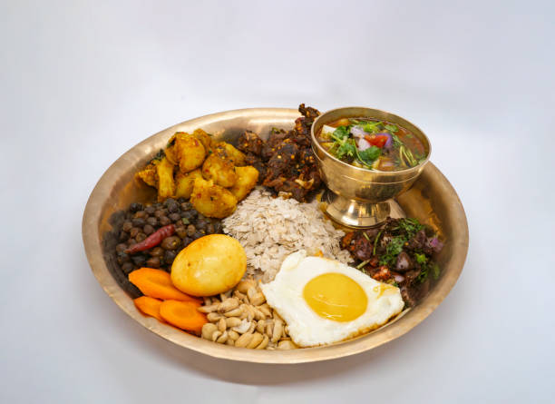 istock Newari Khaja Set Typical Nepali Thali with Rice Flakes, Choyila, Eggs, Chickpeas, Tama, Bamboo Soup, Aalu Sadheko Lunch 2159462390