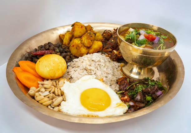 istock Newari Khaja Set Typical Nepali Thali with Rice Flakes, Choyila, Eggs, Chickpeas, Tama, Bamboo Soup, Aalu Sadheko Lunch 2159462404