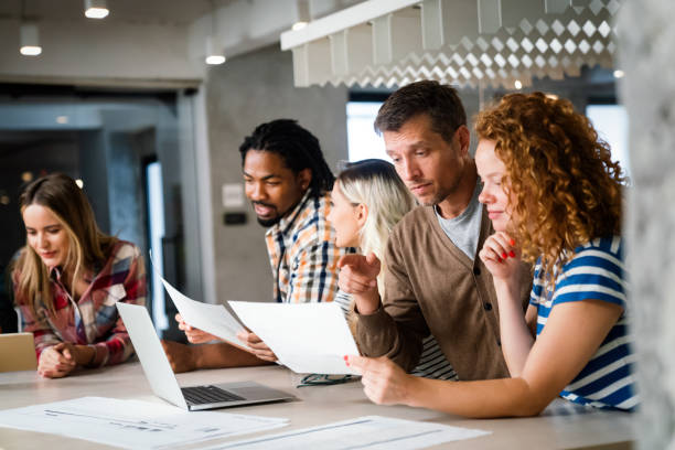 istock Successful multiethnic group of designers, architects, business people at work in office 2159462718