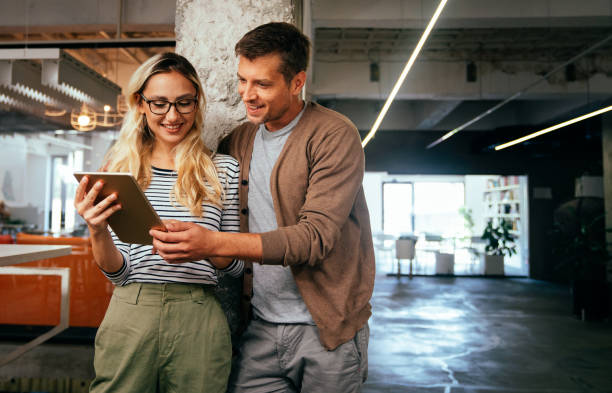 istock Business people having fun, teamwork and chatting at workplace office together. 2159462822