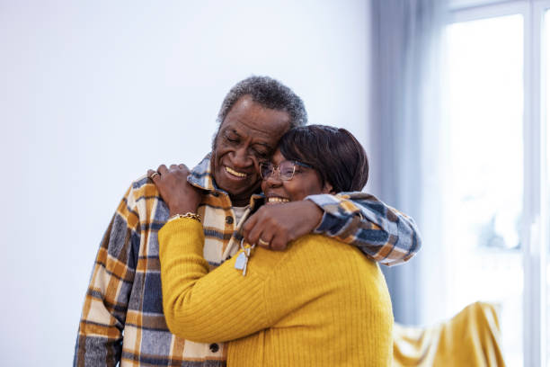 istock Elderly Couple Embracing in New Home 2159466754