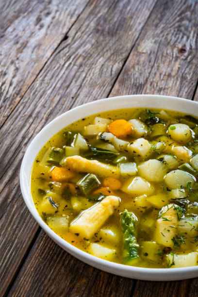 istock Asparagus soup on wooden table 2159467771