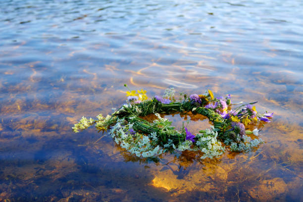 istock Flower Wreath on Water River. Ligo, Ivan Kupala. Midsummer Solstice Holiday concept 2159469434