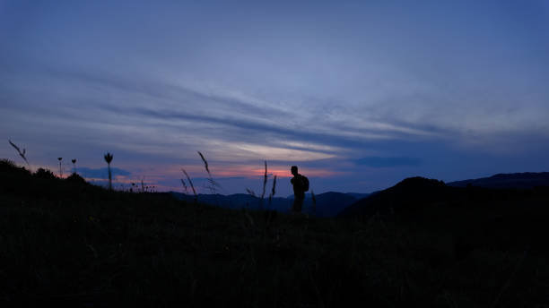 istock Man walking in nature during blue hour time. 2159471060
