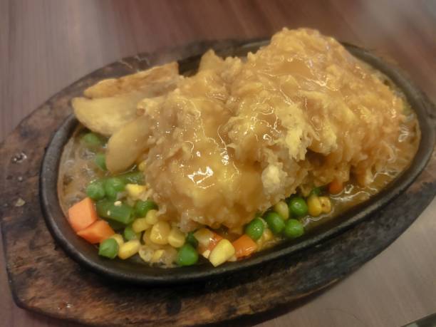Chicken steak with fires and veggie with brown sauce