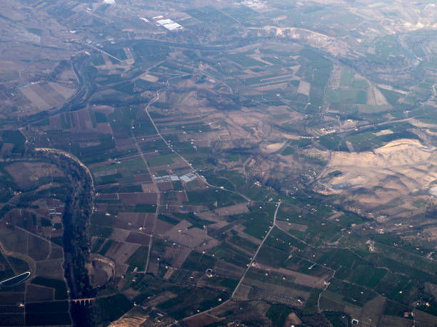 istock etna sicily farmed fields aerial view from airplane 2159472051