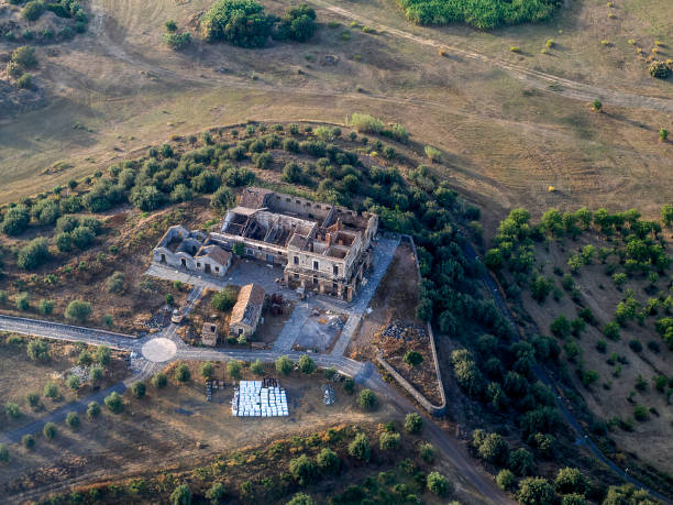 istock Abandoned farm etna sicily farmed fields aerial view from airplane 2159472125