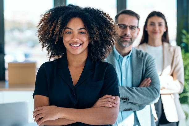 istock Successful business multiage team posing and looking at camera in modern startup. 2159472611