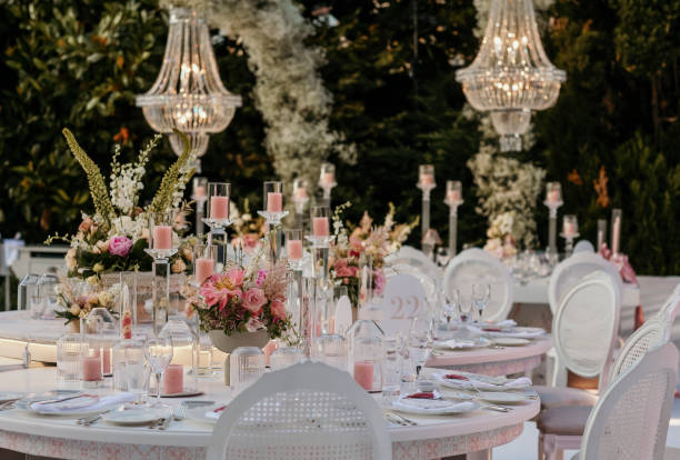 istock Beautiful table setting with crockery and flowers for a party, wedding reception or other festive event. Glassware and cutlery for catered event dinner. stock photo 2159475891