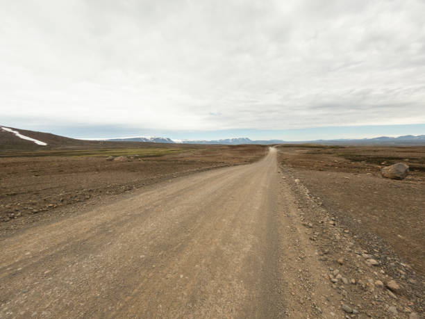 istock Remote Gravel Road through Rocky Landscape 2159477088