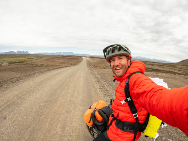 istock Joyful man on a bike packing trip in Iceland 2159477103