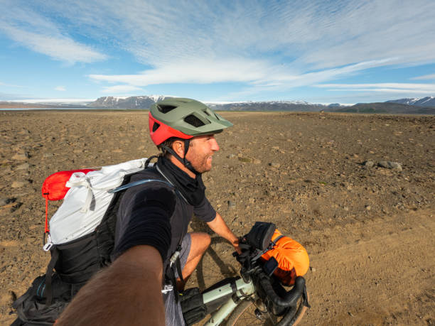 istock Cyclist Taking Selfie on Rocky Terrain with Mountain View 2159477218
