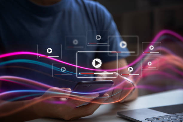 istock Young man using mobile phone playing social media with live streaming video. 2159479841