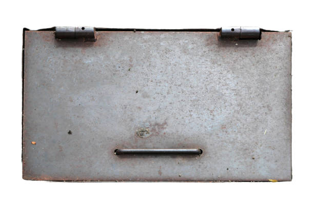 The rusty tin box was once painted white. Isolated on black