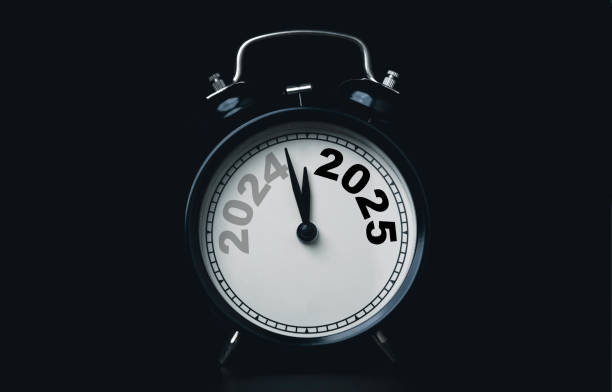 istock 2024 and 2025 on black alarm clock on dark background with copy space  for preparation of Merry Christmas and Happy new year concept. 2159481865