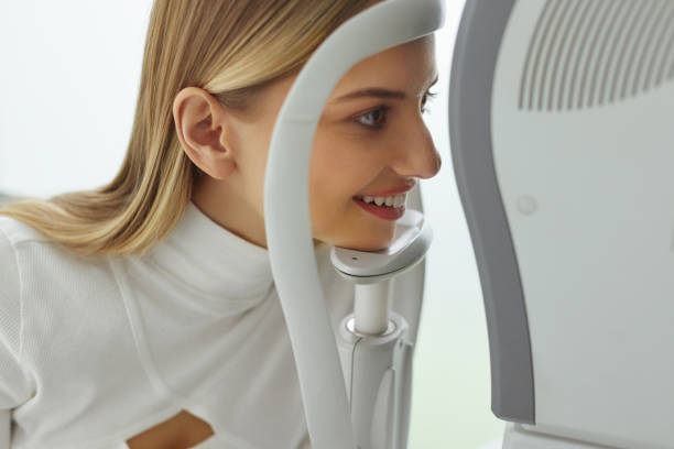 istock Eyesight Exam. Woman Checking Eye Vision On Optometry Equipment 2159482958