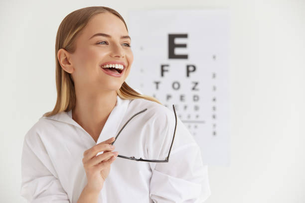 istock Optometry And Vision. Smiling Girl At Ophthalmologist Office 2159483035