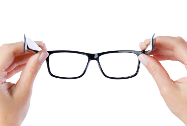 istock Woman hands holding black eyeglasses 2159483797