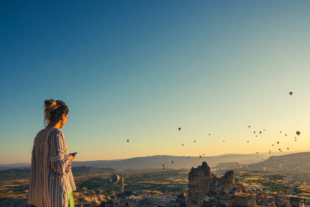 istock Woman enjoys morning in Cappadocia 2159483867