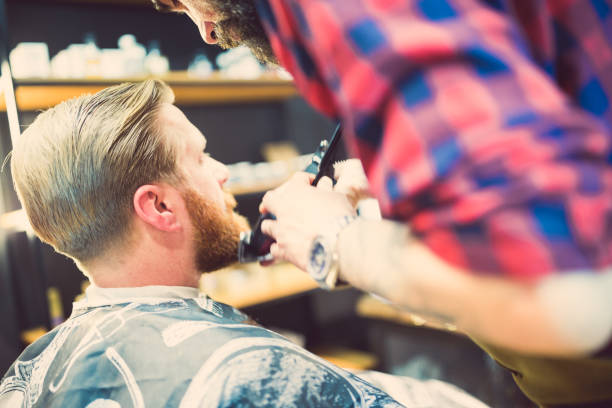 istock Barber Shaping Beard in Modern Barber Shop 2159484757