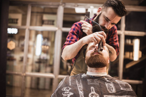 istock Barber Grooming Client in Evening Shop Session 2159484771