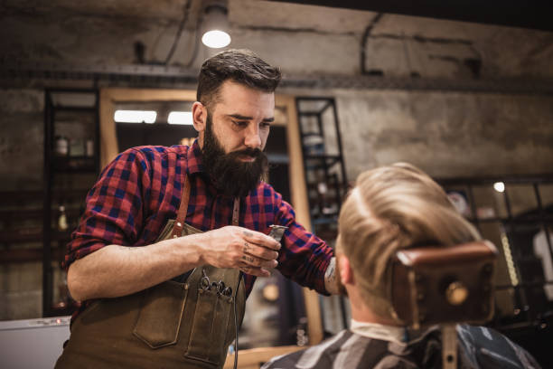 istock Retro Barber in Action: Evening Haircut Session 2159484780