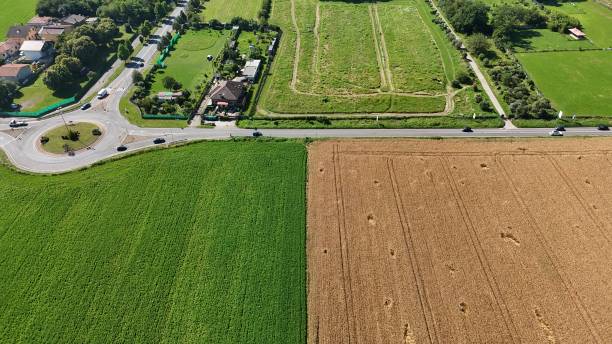 istock road with roundabout in the middle of the fields 2159486157