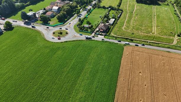 istock road with roundabout in the middle of the fields 2159486223