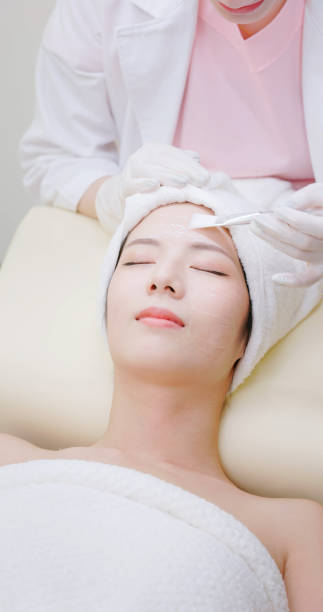 istock female beautician skin care client 2159486667