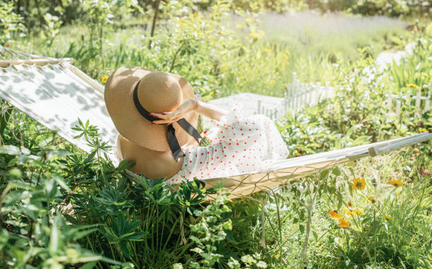 istock Woman relaxing in a hammock 2159489275